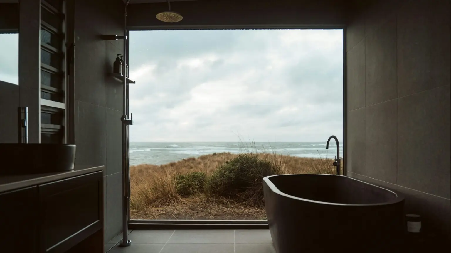 "View from sustainable passive house bathroom overlooking coast – The Passive House Way process"